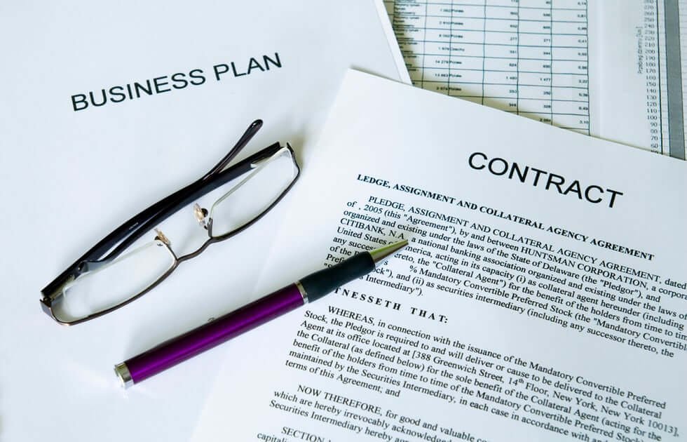 Business plan and business contract glasses and pen for starting a business