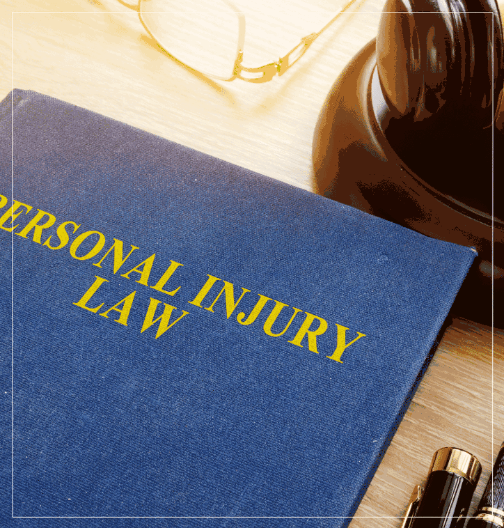 Personal injury law book with gavel and glasses